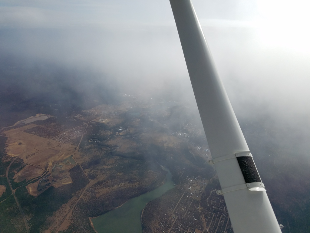 Small clouds dotted the way, and somehow our flight blasted through most of them.